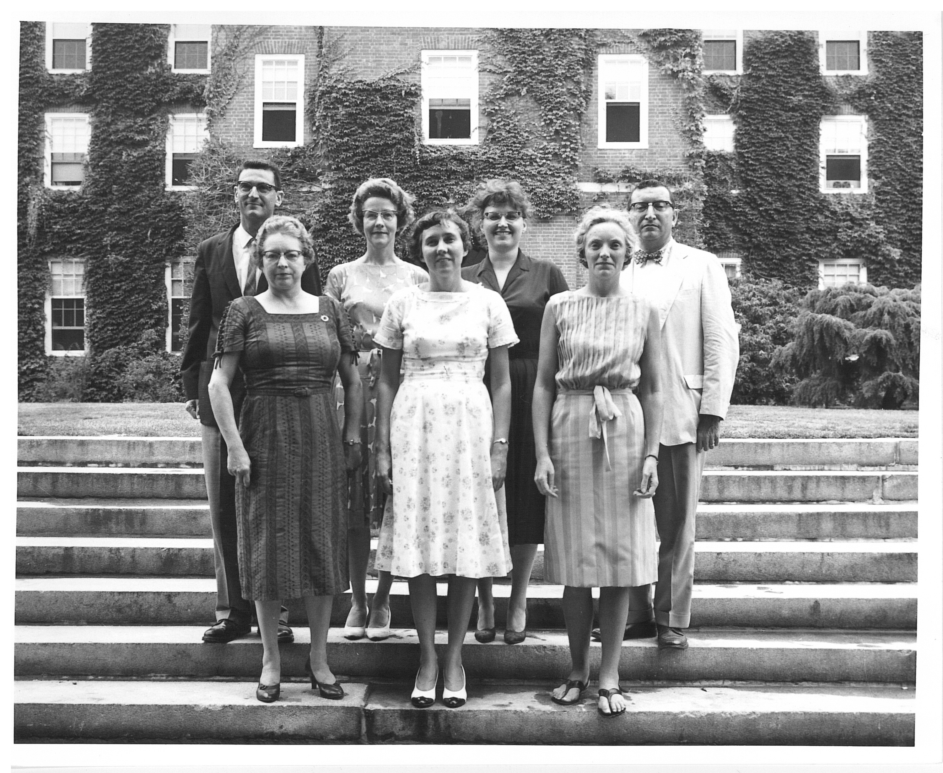 Black and white photo of seven people.